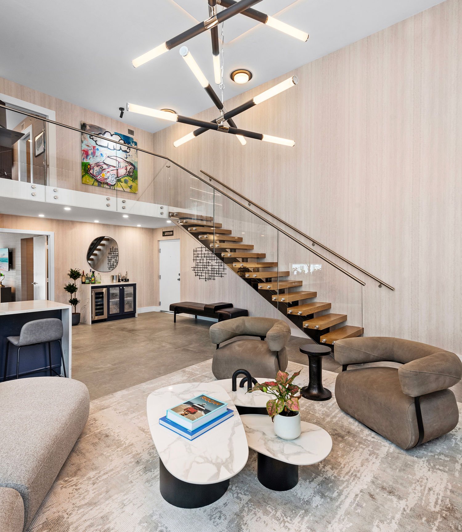 Light-filled South Beach loft by Hannah Brooke Design with a sculptural floating staircase