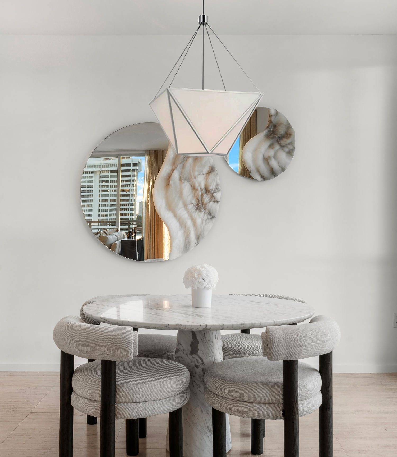 Sunlit Miami dining room designed by Hannah Brooke Design with sculptural lighting and natural textures