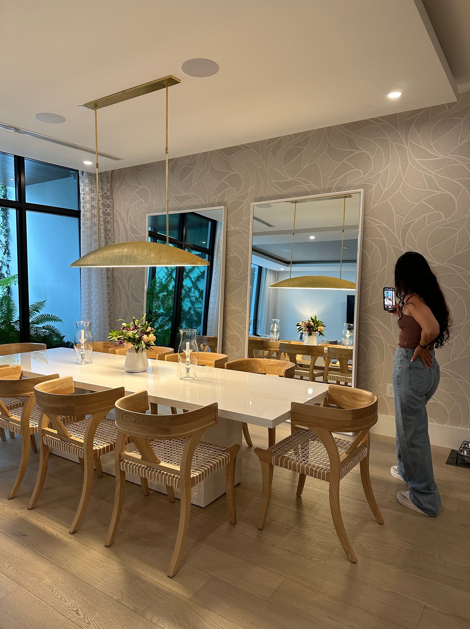 Dining room with sculptural brass pendant by Hannah Brooke Design